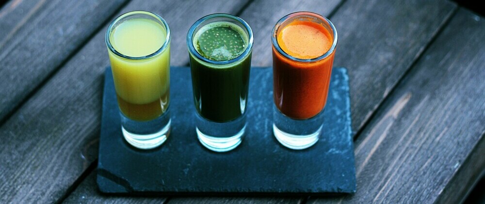 A row of glasses filled with nutritional supplements from one of the Top Nutritional Supplement Companies